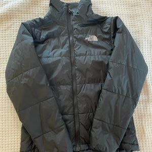 Woman’s black north face puffer jacket